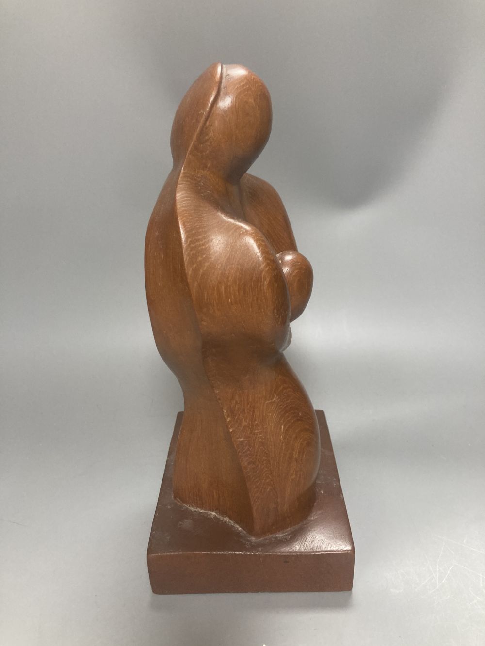 After Henry Moore, two related figural sculptures in wood and plaster, 31cm, white composition, 28cm